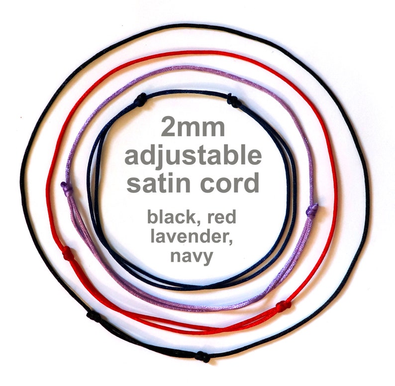 May include: Four 2mm adjustable satin cords in black, red, lavender, and navy.