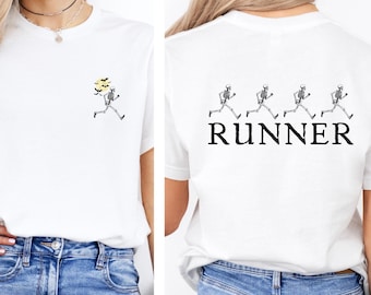 May include: White t-shirt with a skeleton running with a yellow flower on the front and four skeletons running with the word "RUNNER" on the back.