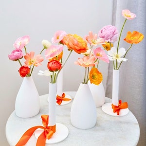 Orange pink white artificial flower vases, mixed flower bud vases, colorful wedding reception flowers, bridal shower / party table flowers