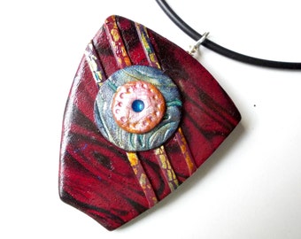 Button Shield handmade pendant necklace wearable art statement necklace polymer clay black red blue mica metallic bead rubber cord abstract