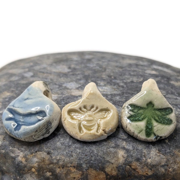 three drop shaped birds and bees beads