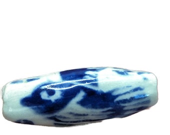 spindle shaped bead - bird and moon in blue and white