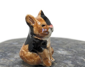 Figurine miniature de chat en calicot