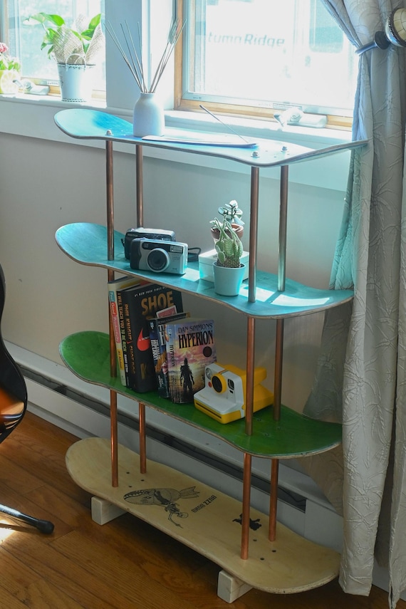 Recycled skateboard shelving system showing creative furniture repurposing for interior design