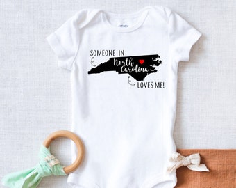 Someone in North Carolina Loves Me Bodysuit {newborn coming home outfit, city state bodysuit, heart over city, baby shower gift}