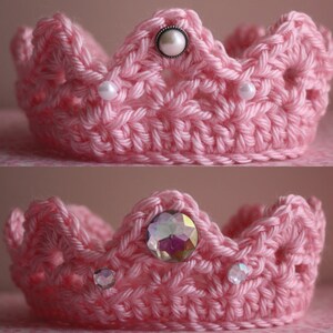 May include: Two pink crocheted crowns with decorative embellishments. The top crown has white pearl-like beads and a larger pearl-like bead in the center. The bottom crown has iridescent rhinestones.