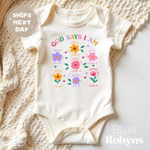Natural baby onesie with printed design of flowers and bible affirmation verses - God says I am