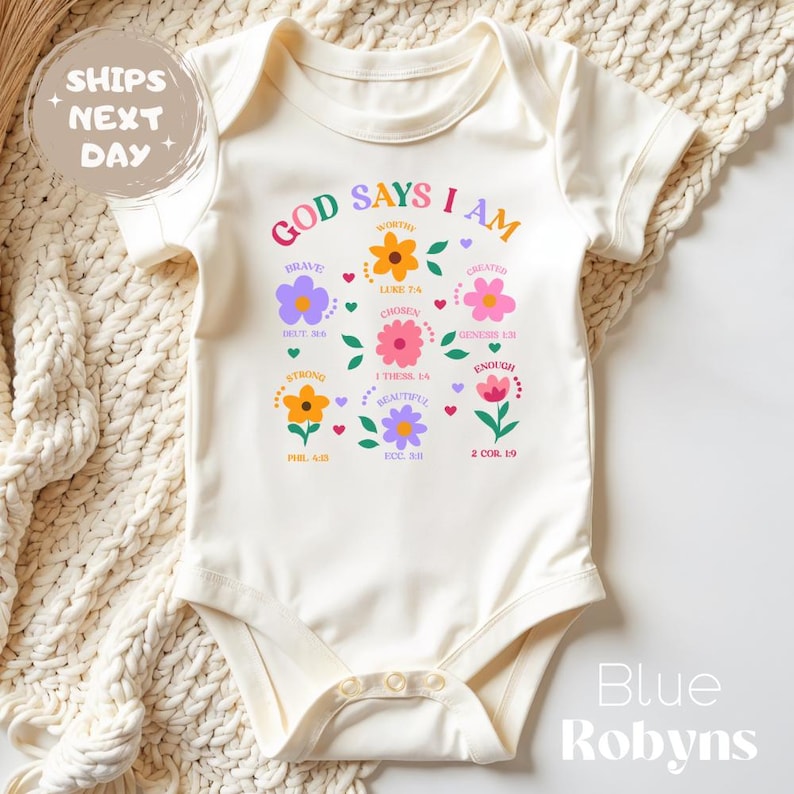 Natural baby onesie with printed design of flowers and bible affirmation verses - God says I am