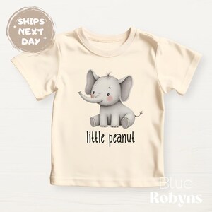 cute elephant “little peanut” baby onesie

baby t-shirt with elephant print

little peanut baby gift for shower

newborn coming home outfit little peanut

gender neutral elephant baby outfit

baby girl elephant onesie little peanut

baby boy elephant clothes little peanut

personalized elephant baby onesie

soft cotton elephant baby bodysuit

adorable little peanut baby sweatshirt