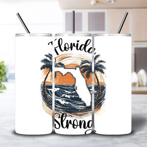 May include: Three white stainless steel tumblers with a graphic of a palm tree, the state of Florida, and the words "Florida Strong".