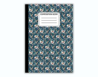 May include: Composition book with a teal background and a repeating pattern of colorful feathers. The cover has a white label with the words "COMPOSITION BOOK" printed on it.