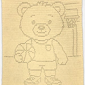 May include: A rectangular cream-coloured crochet blanket featuring a central filet crochet design of a teddy bear holding a basketball. The bear is depicted standing next to a basketball hoop, with the entire image formed by open stitch patterns.