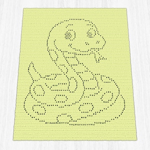 May include: A crocheted blanket in a light yellow color features a black outline of a cartoon snake. The snake has a smiling face, a forked tongue, and a patterned body. The blanket is rectangular and appears to be handmade.