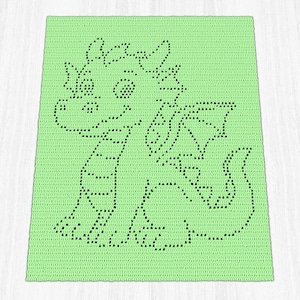 May include: A crocheted blanket in a light green color featuring a black outline of a friendly dragon. The dragon has wings, a tail, and a smiling face. The blanket is square-shaped and appears to be handmade.