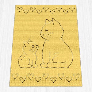 May include: A rectangular yellow crochet blanket featuring a dark brown pixelated design of a large cat sitting next to a smaller kitten. The top and bottom borders of the blanket are decorated with a repeating pattern of small dark brown hearts.