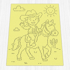 May include: A yellow crocheted blanket featuring a cowboy riding a horse, with a sun, clouds, and a cactus. The design is created with black stitches, giving a dotted outline effect. The blanket has a rectangular shape.