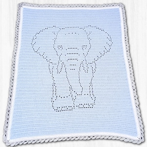 May include: A light blue crochet blanket featuring a dark blue elephant silhouette created with a stitch pattern. The blanket is bordered by a thin white line and a decorative grey scalloped edge, showcasing a detailed handmade textile design.