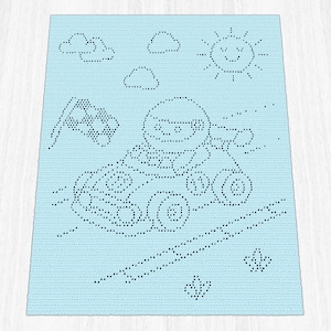 May include: A light blue rectangular crochet blanket featuring a dark blue dotted pattern of a race car driver in a vehicle, a chequered flag, a smiling sun, and clouds. The design is created using a pixelated style with dark blue yarn stitches.