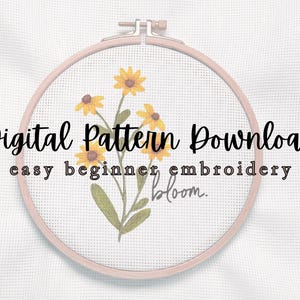 May include: A digital embroidery pattern download featuring a floral design with yellow flowers and green leaves. The design is displayed in a wooden embroidery hoop. Text includes "Digital Pattern Download" and "easy beginner embroidery".