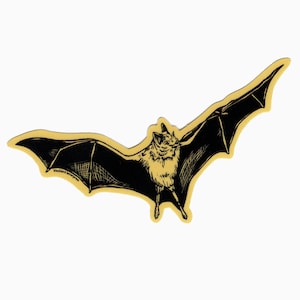 May include: A black and white illustration of a bat with its wings spread out. The bat is on a yellow background.