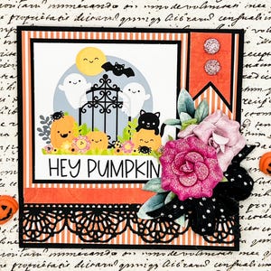 May include: A Halloween-themed greeting card with a central image featuring a smiling moon, ghosts, pumpkins, and a black cat. The phrase "HEY PUMPKIN" is displayed. The card is decorated with orange and black accents, flowers, and decorative lace.