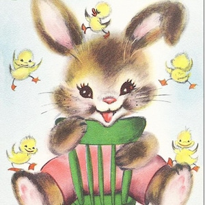 May include: A brown bunny rabbit wearing pink pants sits on a green chair.  The bunny is smiling and has big brown eyes.  Four yellow ducklings are surrounding the bunny.  The text "HAPPY EASTER" is at the top of the image.
