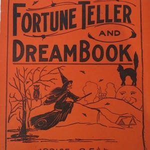 May include: Orange vintage book cover titled "Fortune Teller and Dream Book" with the text "Egyptian Witch." The cover features a black silhouette of a witch on a broom, a black cat, and a smiling moon. Bats and an owl are also depicted.
