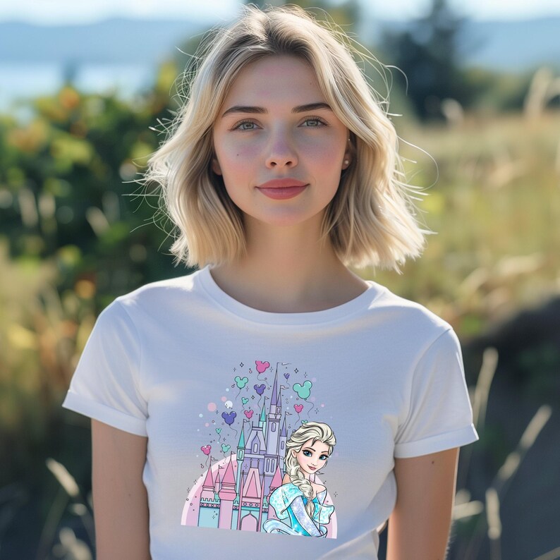 a woman wearing a white shirt with a castle on it