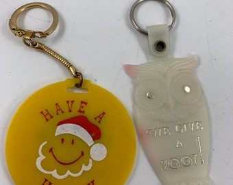 Pair of Vintage Plastic Advertising Owl & Christmas Happy Face Keychains from Elkton Bank in KY and HA Hampton and Sons in Trenton KY