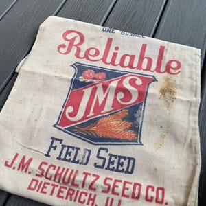 May include: A rustic wooden sign with the text "Welcome to our home" in white lettering. The sign features a distressed finish and a simple, inviting design, perfect for a front porch or entryway.