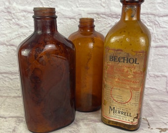 Trio of Vintage Antique Amber Glass Colored Bottles