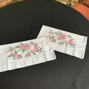Pair of Vintage White Poly Cotton Blend Pillowcases With Hand Cross Stitch Embroidery Pink Flowers & Blue Butterflies
