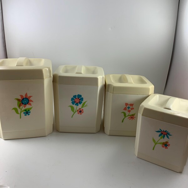Vintage Four Piece SEARS Plastic Canister Set Floral Design Graduated Sizes