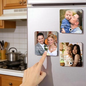 May include: Square magnets with photos of people, including a wedding couple, a father kissing a baby, and two women. Each magnet displays a music player interface with the text "Because You Live" and the artist's name.