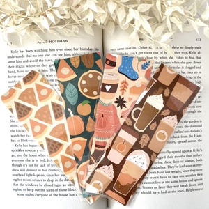 May include: Five colorful bookmarks with fall-themed illustrations. The bookmarks feature images of coffee cups, pumpkin pie, and autumn leaves.