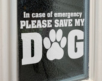 May include: White vinyl sticker on a glass door that reads "In case of emergency PLEASE SAVE MY DOG" with a paw print in the middle of the word "DOG".