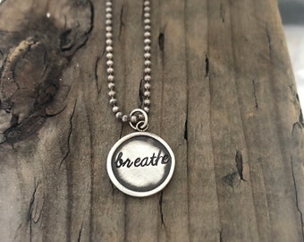 breathe. let this sterling silver charm necklace reminds you to pause and appreciate the little things in life . handmade jewelry by SimaG