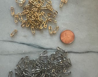wholesale prices sale - safety pins charms in Goldfield and Sterling silver sold individually.