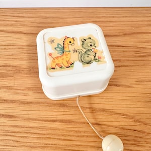 Vintage Sony white plastic pull-string cot crib  music box