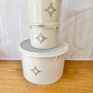Tupperware 3 set of large almond coloured with starburst motif