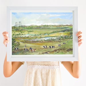 May include: A watercolor painting of a rural landscape with a bridge in the distance, a river, and a herd of black and white cows grazing in a field.