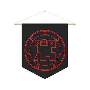 May include: A black fabric banner with a red sigil featuring a stylized castle and the letters "H A P H A S" around the perimeter.