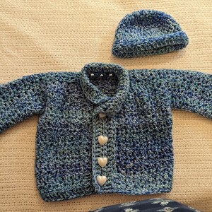 blue baby crochet sweater with heart buttons