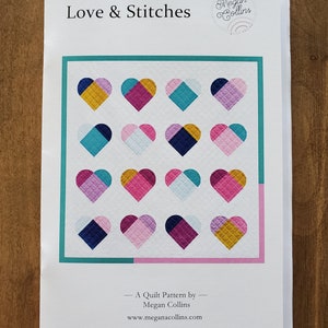 May include: A quilt pattern titled "Love & Stitches" by Megan Collins. The pattern features a grid of 16 colorful hearts with a variety of geometric designs. The pattern is available for purchase at www.meganacollins.com.