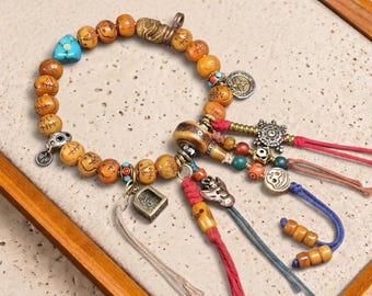Ciondolo Dzi himalayano intarsiato in turchese e agata, ciondolo totem mistico con terminali in ottone, perlina tribale per collana mala.