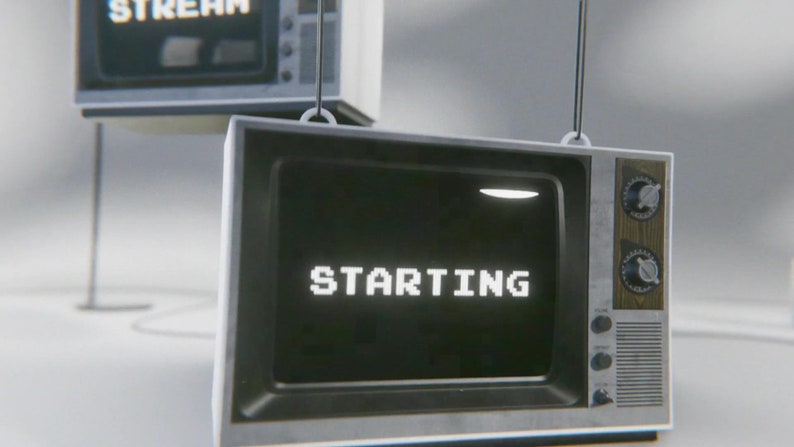 May include: A vintage-style television with a black and white screen displaying the word "STARTING" in white pixelated letters. The television is hanging from the ceiling and has a wooden frame with silver knobs.