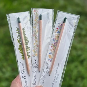Four botanical themed seed pencil giveaways featuring lavender, pink roses, cherry blossoms, and wildflower card designs.