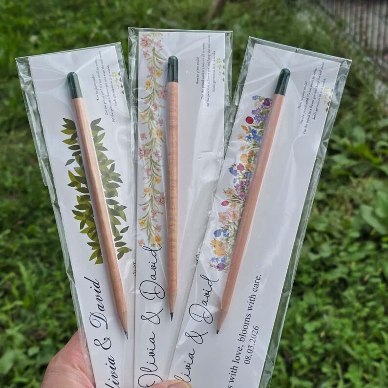 Romantic wedding favor packaging showing the text Two hearts one seed growing into endless love on a white card.