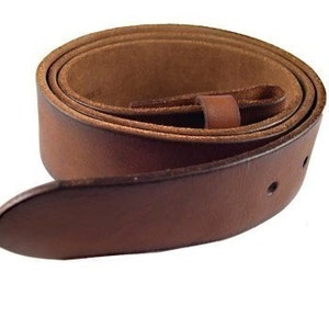 May include: A brown leather belt with a buckle and a single keeper. The belt is rolled up and the buckle is visible.