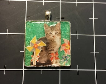 Pinwheel Kitten. 50% of the proceeds goes to the current focus charity